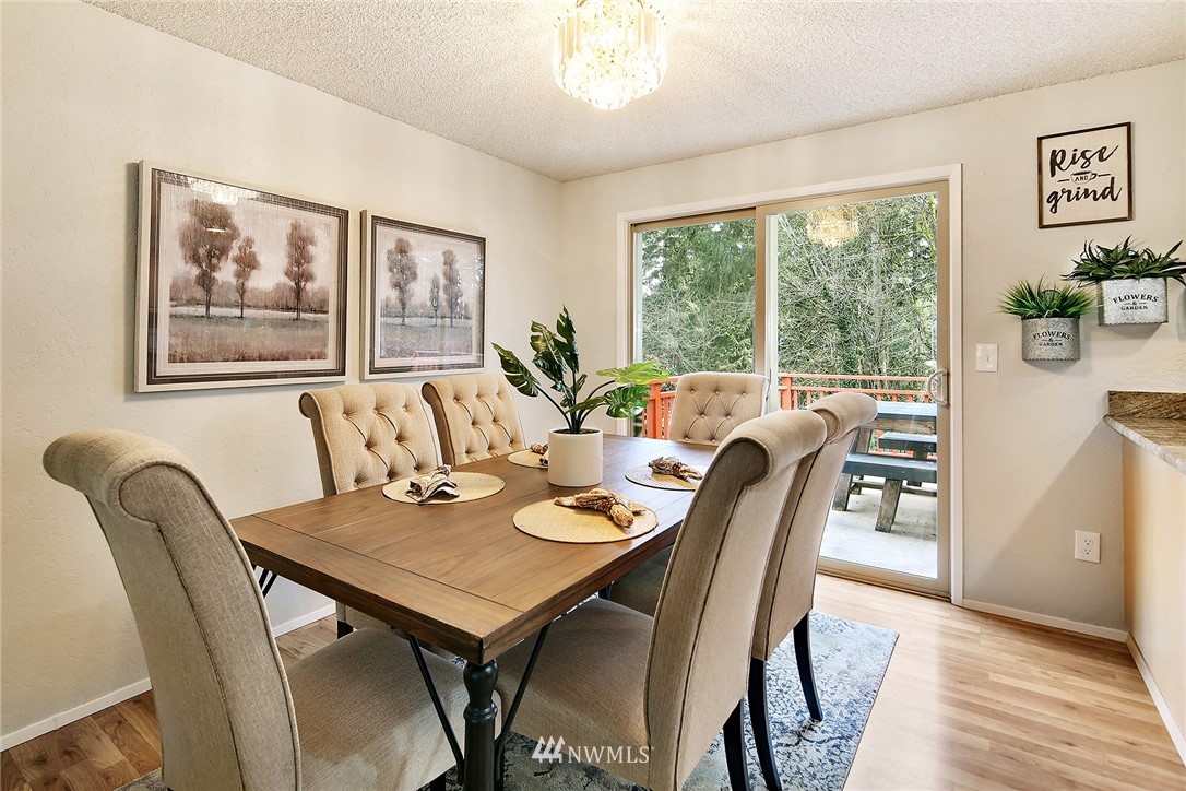 22605 1st Drive Southeast Bothell, WA 98021 - Photo 10 of 27 a view of a dining room with furniture window and wooden floor