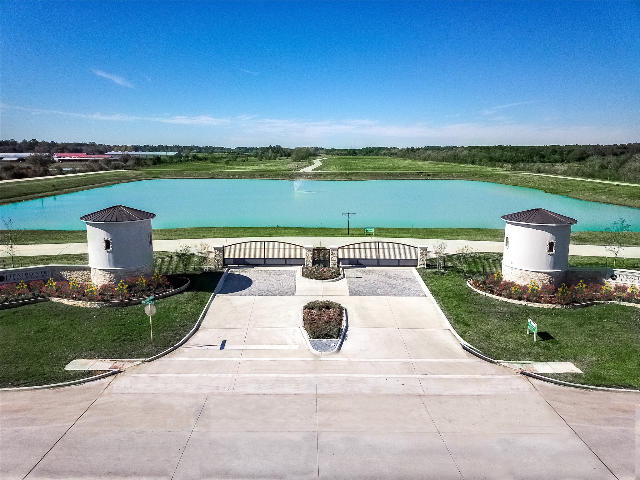 20719 Tealpointe Ridge Lane Tomball, TX 77377 - Photo 1 of 7 a view of a lake with a garden