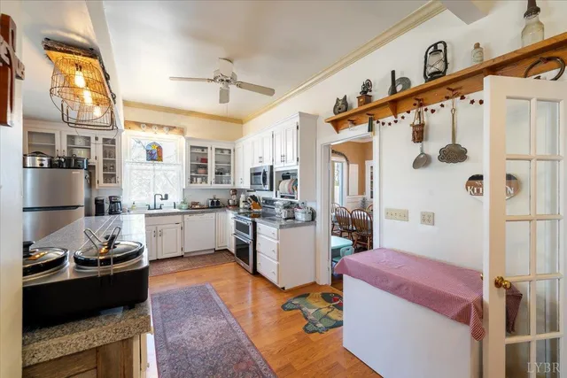 a kitchen with sink cabinets and stove