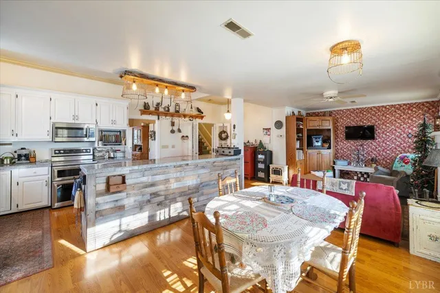 a large kitchen with a table and chairs in it