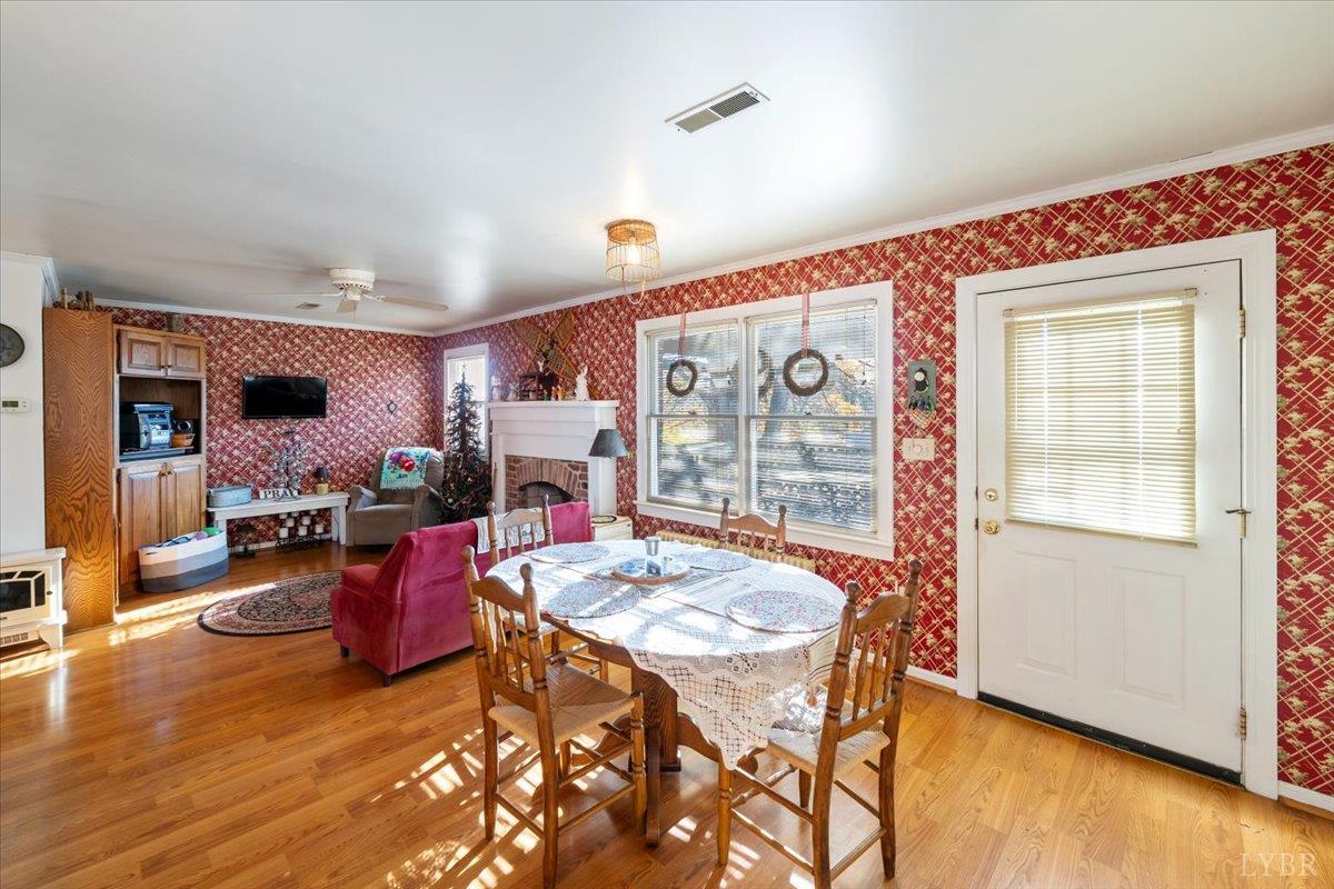 601 Henry Street Gretna, VA 24557 - Photo 14 of 46 a view of a dining room with furniture and wooden floor