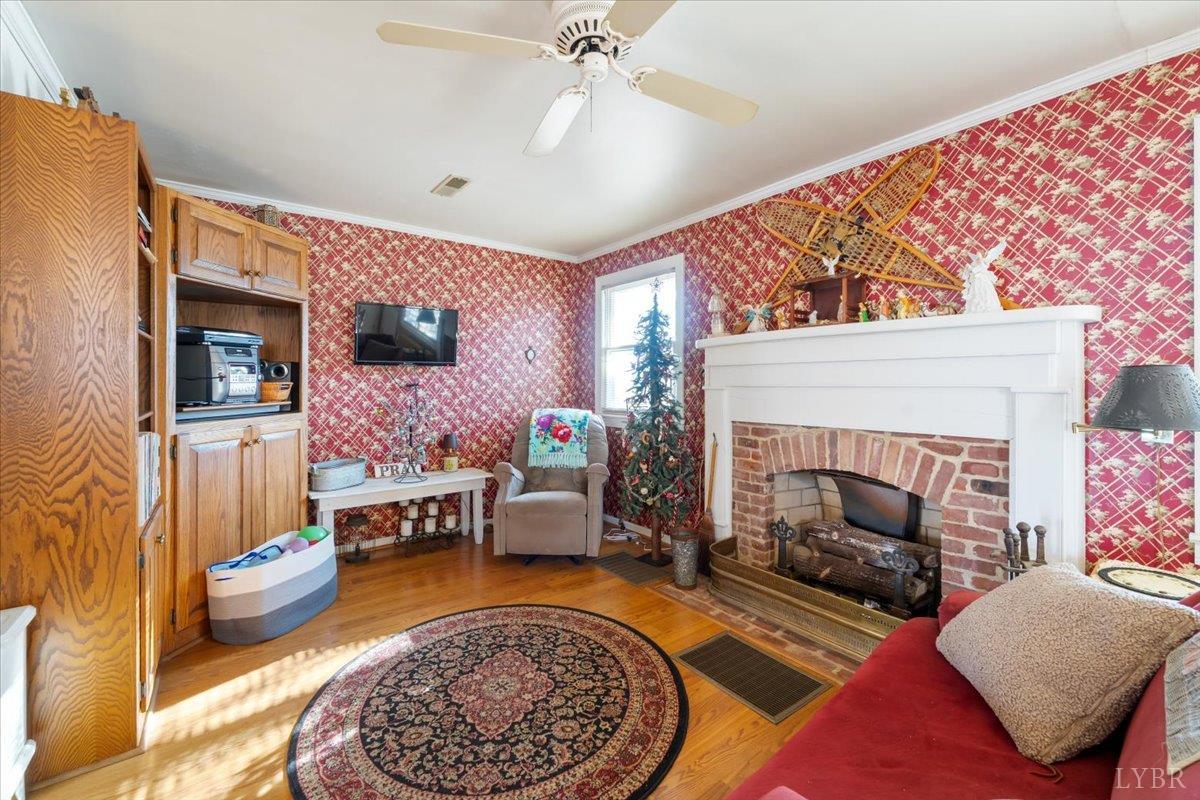 601 Henry Street Gretna, VA 24557 - Photo 15 of 46 a living room with furniture and a fireplace