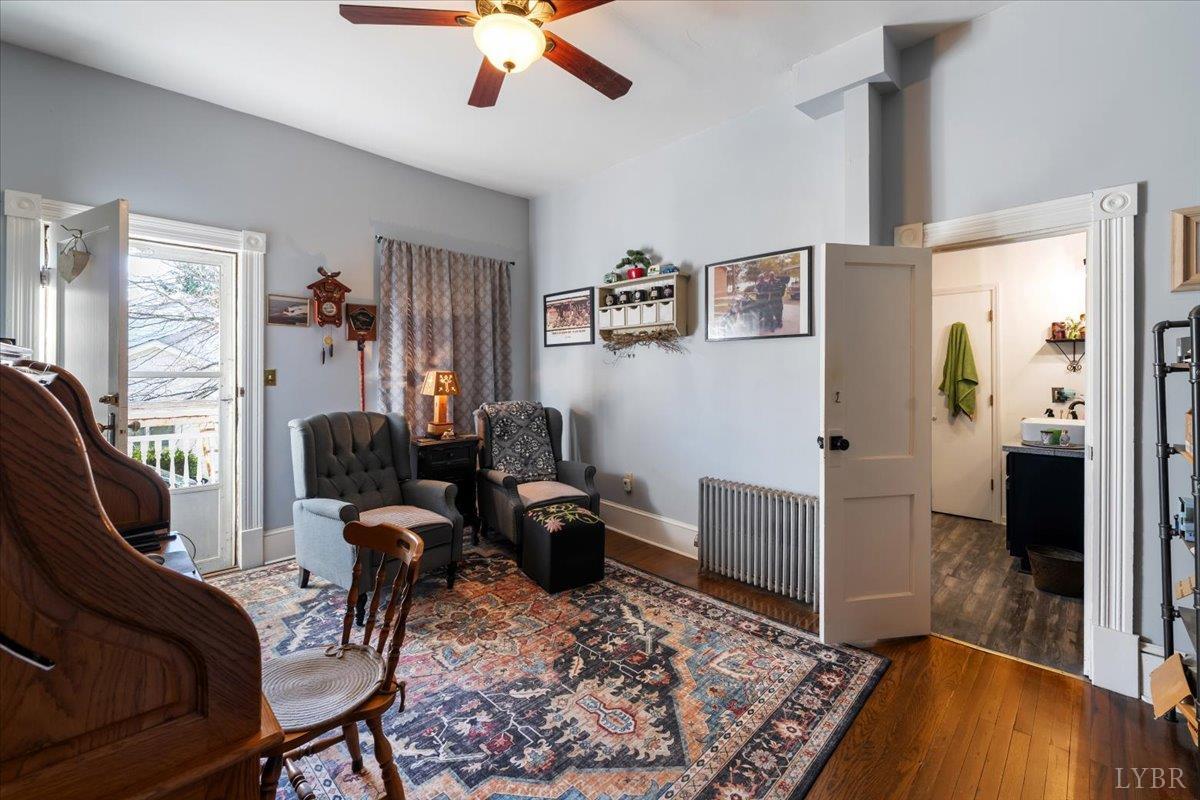 601 Henry Street Gretna, VA 24557 - Photo 20 of 46 a living room with furniture and a wooden floor