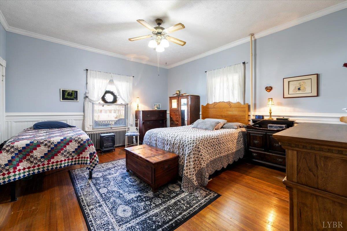 601 Henry Street Gretna, VA 24557 - Photo 23 of 46 a bedroom with a bed and wooden floor