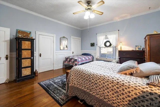 a bathroom with a toilet a sink and shower curtain