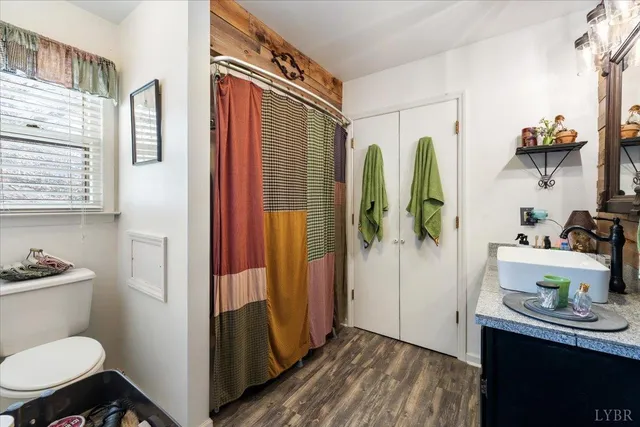 a living room with a couch and bookshelf