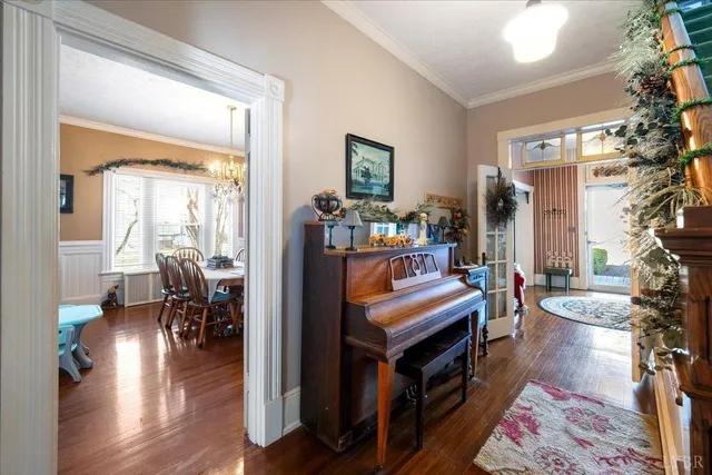 a view of living room filled with furniture and wooden floor