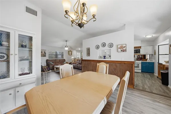 a bed room with furniture and wooden floor