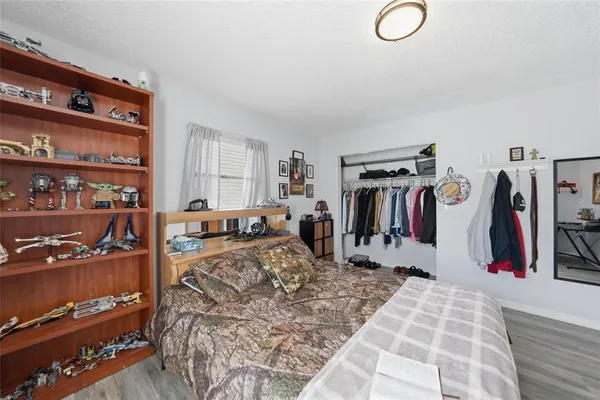a view of a living room with clothes and shoes