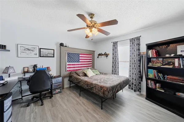 a bedroom with a bed and furniture