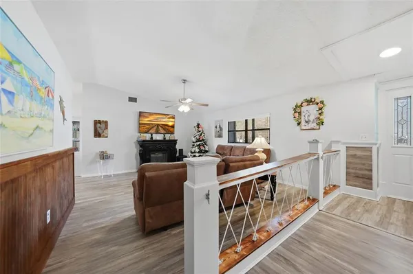 a very nice looking living room with furniture and wooden floor