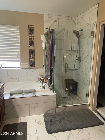 a bathroom with a bathtub and a sink