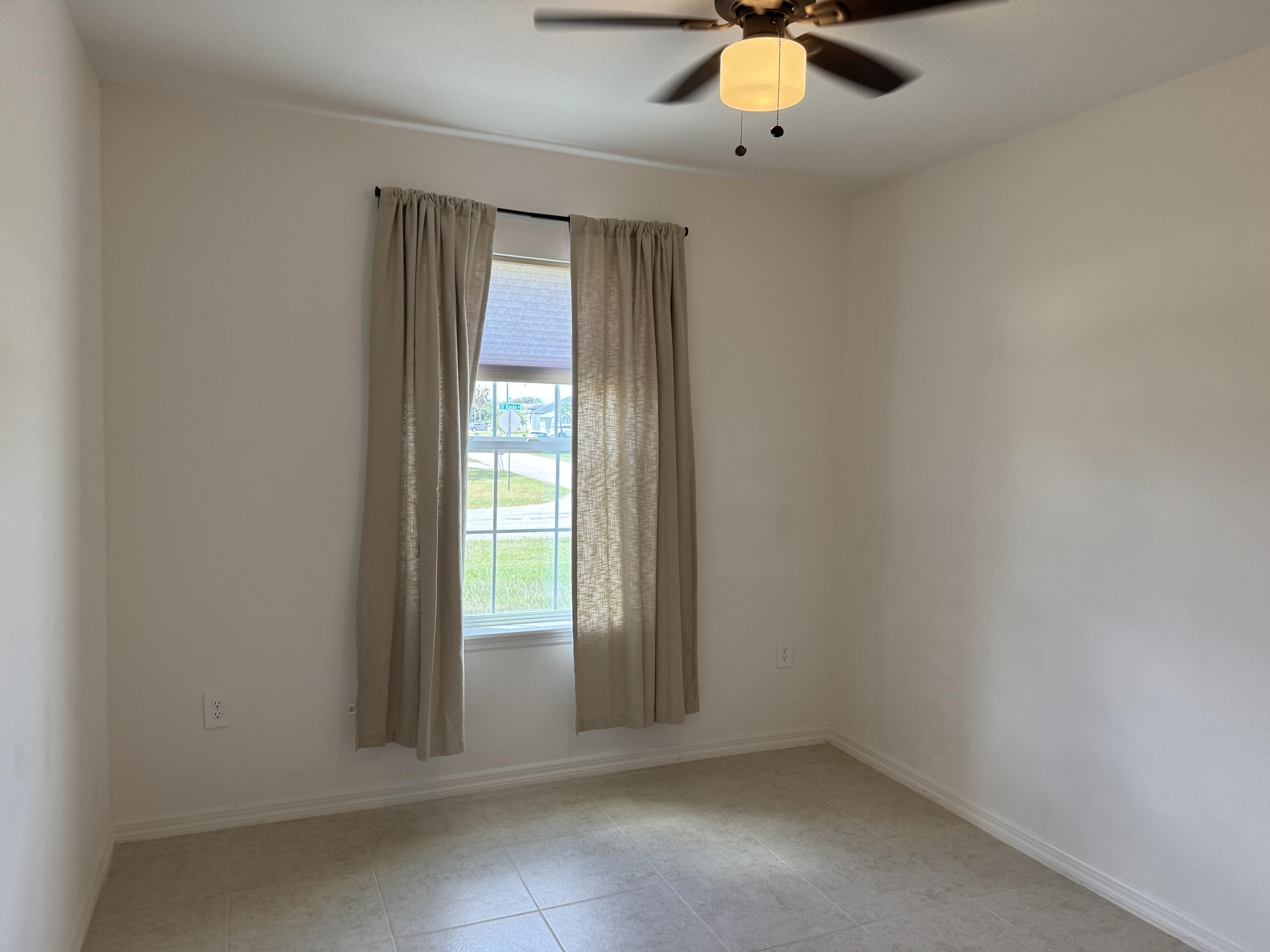 3725 Southwest Kasin Street Port St. Lucie, FL 34953 - Photo 13 of 18 an empty room with window