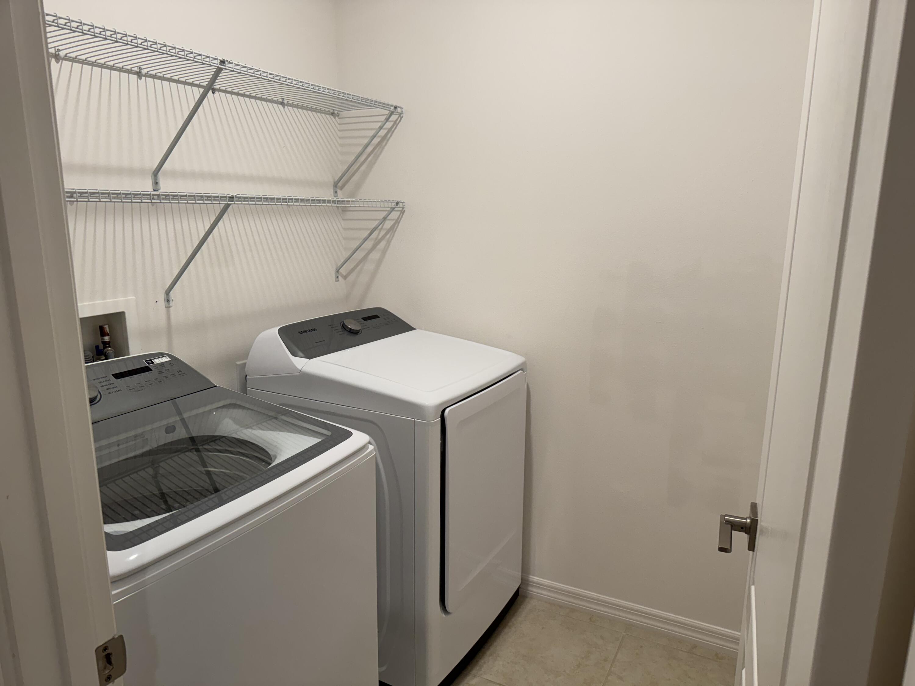 3725 Southwest Kasin Street Port St. Lucie, FL 34953 - Photo 10 of 18 a utility room with dryer and washer