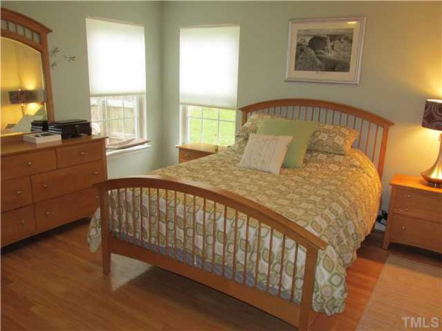 5429 Kassia Lane Raleigh, NC 27616 - Photo 12 of 20 a bed sitting in a bedroom next to a window
