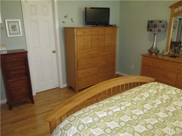 5429 Kassia Lane Raleigh, NC 27616 - Photo 14 of 20 a bedroom with a bed and a flat screen tv