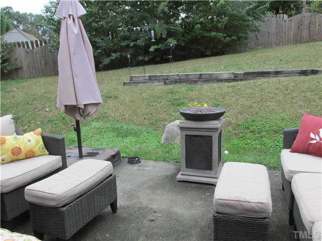 5429 Kassia Lane Raleigh, NC 27616 - Photo 17 of 20 a view of a patio with furniture and a yard