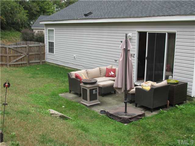 5429 Kassia Lane Raleigh, NC 27616 - Photo 19 of 20 a view of a house with a backyard and a patio