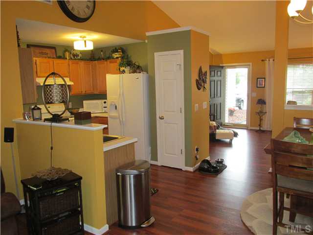 5429 Kassia Lane Raleigh, NC 27616 - Photo 6 of 20 a view of a kitchen with workspace and a living room
