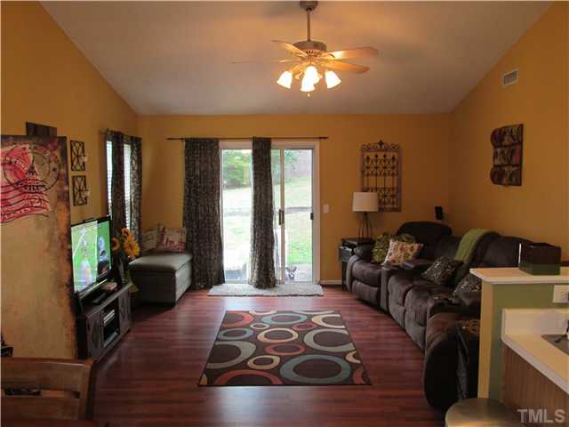 5429 Kassia Lane Raleigh, NC 27616 - Photo 7 of 20 a living room with furniture and a chandelier