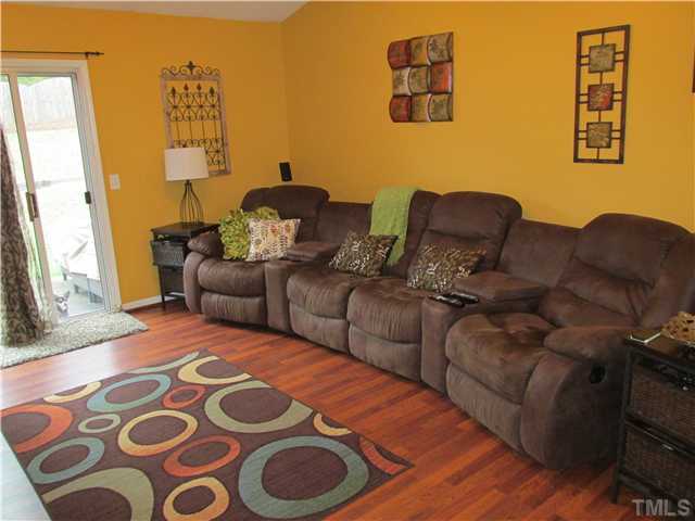 5429 Kassia Lane Raleigh, NC 27616 - Photo 8 of 20 a living room with couches and painting on the wall