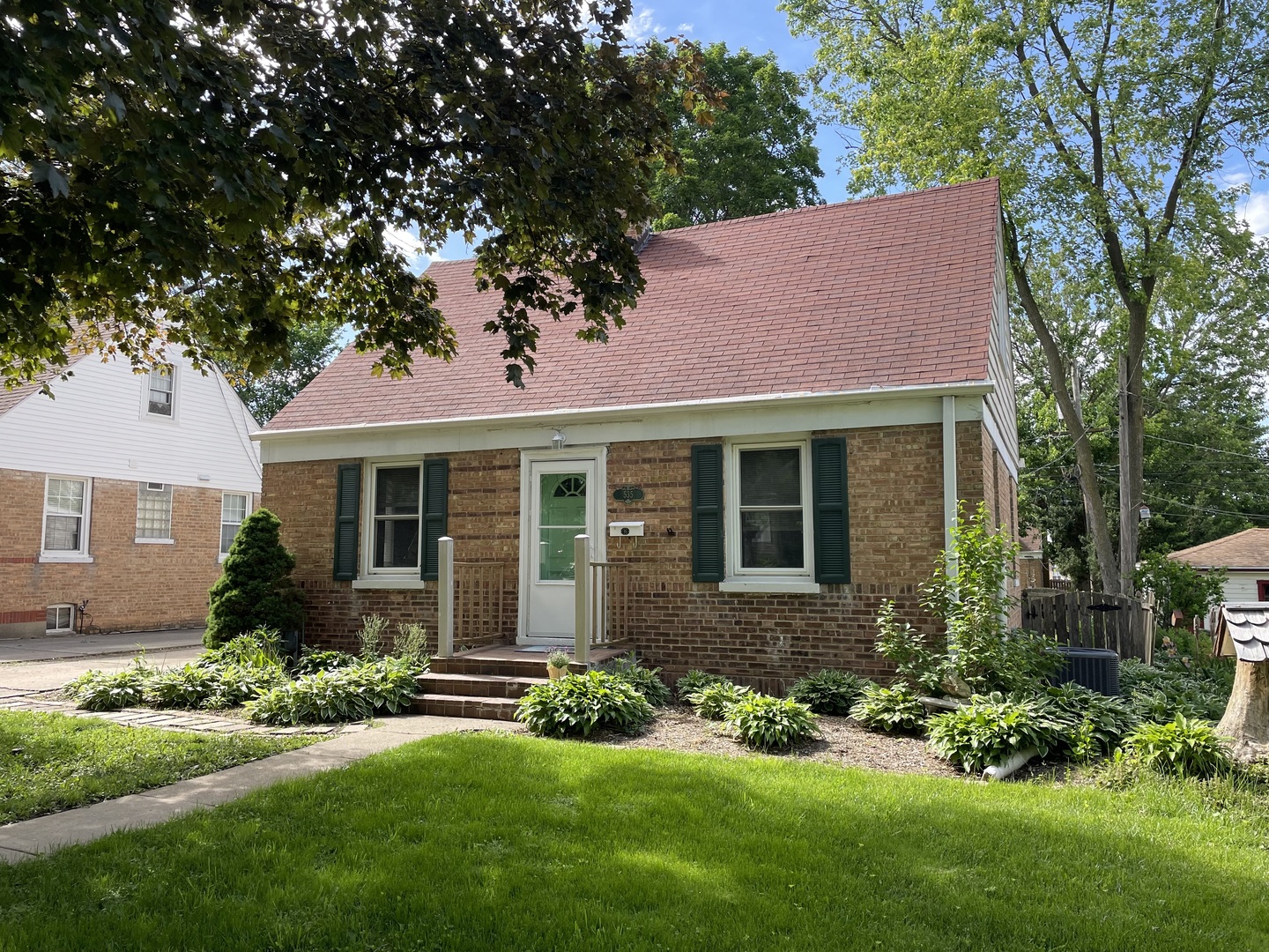 535 Kendall Lane DeKalb, IL 60115 - Photo 1 of 14 a front view of a house with a yard and porch
