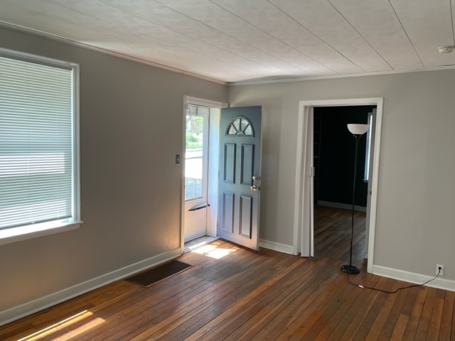 535 Kendall Lane DeKalb, IL 60115 - Photo 3 of 14 an empty room with wooden floor and windows