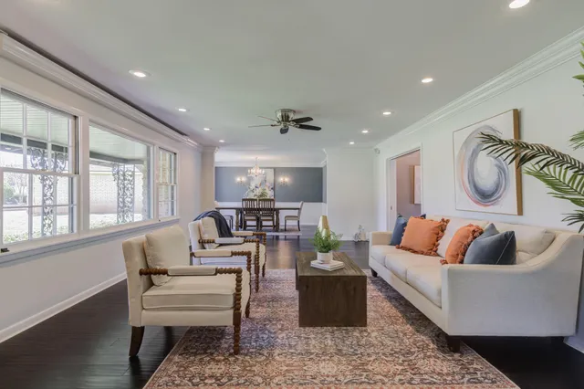 a living room with furniture fireplace and a flat screen tv