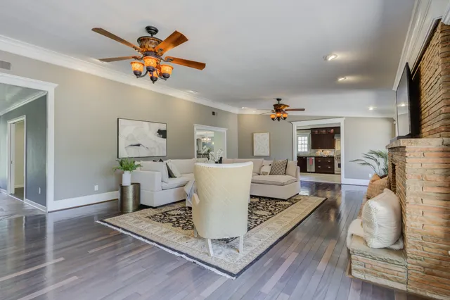 a bedroom with a bed and a potted plant