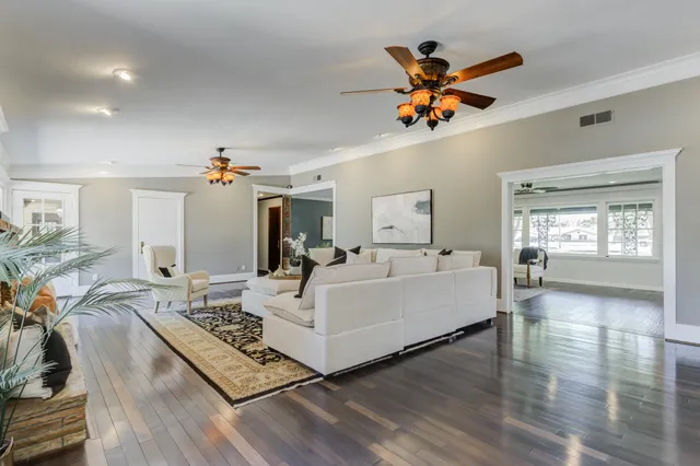 a bathroom with a bathtub and next to a window