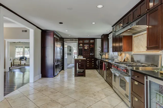 a bathroom with a bathtub sink and mirror