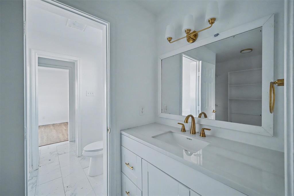 1781 South Munson Road Royse City, TX 75189 - Photo 12 of 33 a bathroom with a sink and a mirror