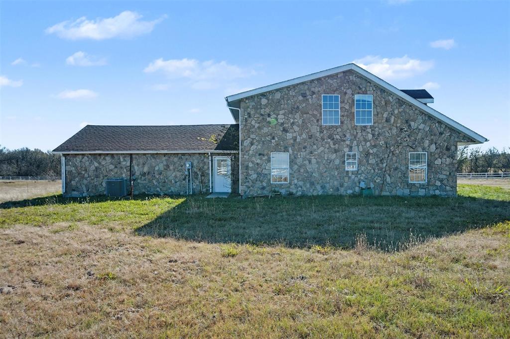 1781 South Munson Road Royse City, TX 75189 - Photo 3 of 33 a front view of a house with a yard and garage