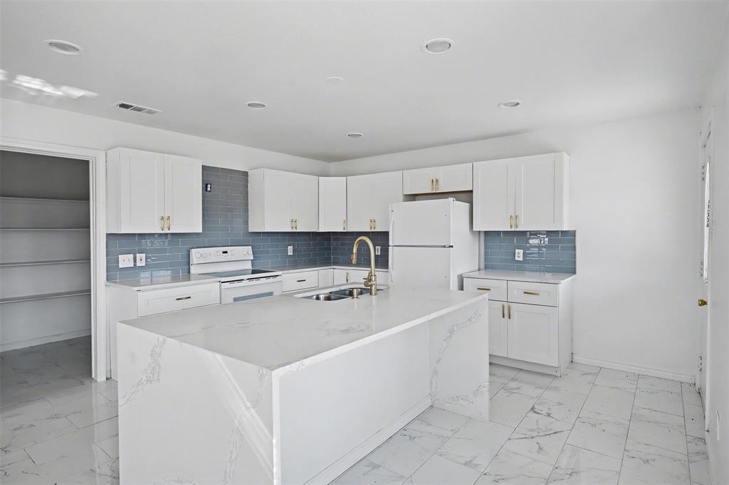 1781 South Munson Road Royse City, TX 75189 - Photo 6 of 33 a kitchen with cabinets and stainless steel appliances