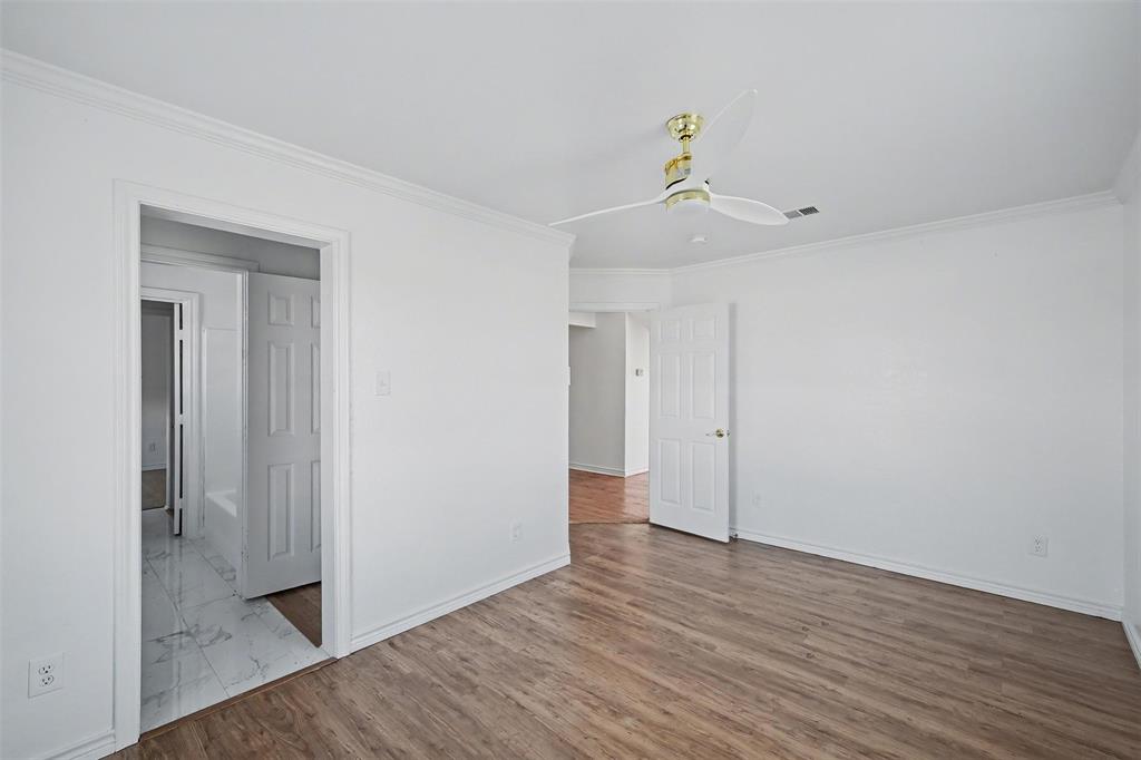 1781 South Munson Road Royse City, TX 75189 - Photo 10 of 33 a view of a livingroom with wooden floor and a hallway