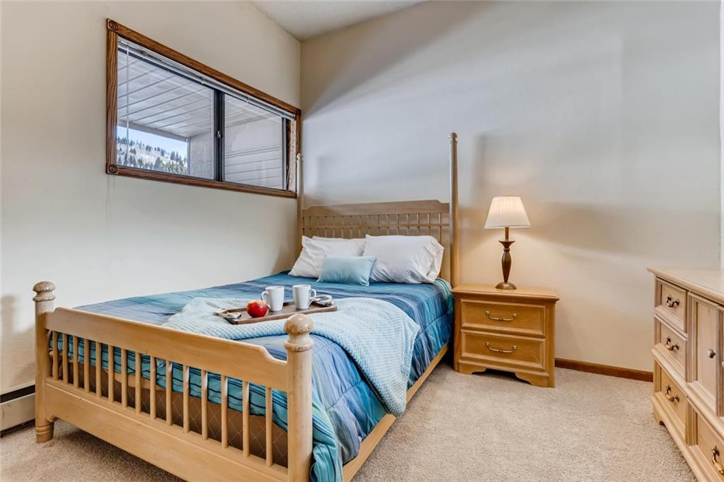 760 Copper Road, Unit 201 Copper Mountain, CO 80443 - Photo 13 of 28 a bedroom with bed and a window