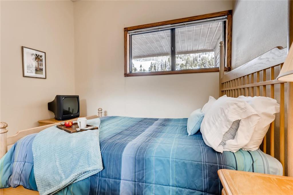 760 Copper Road, Unit 201 Copper Mountain, CO 80443 - Photo 14 of 28 a bedroom with furniture and a window