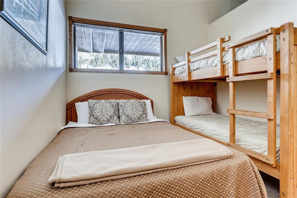 760 Copper Road, Unit 201 Copper Mountain, CO 80443 - Photo 15 of 28 a bedroom with a bed and window