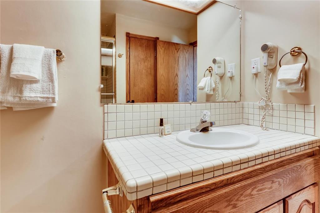 760 Copper Road, Unit 201 Copper Mountain, CO 80443 - Photo 17 of 28 a bathroom with a sink and a mirror