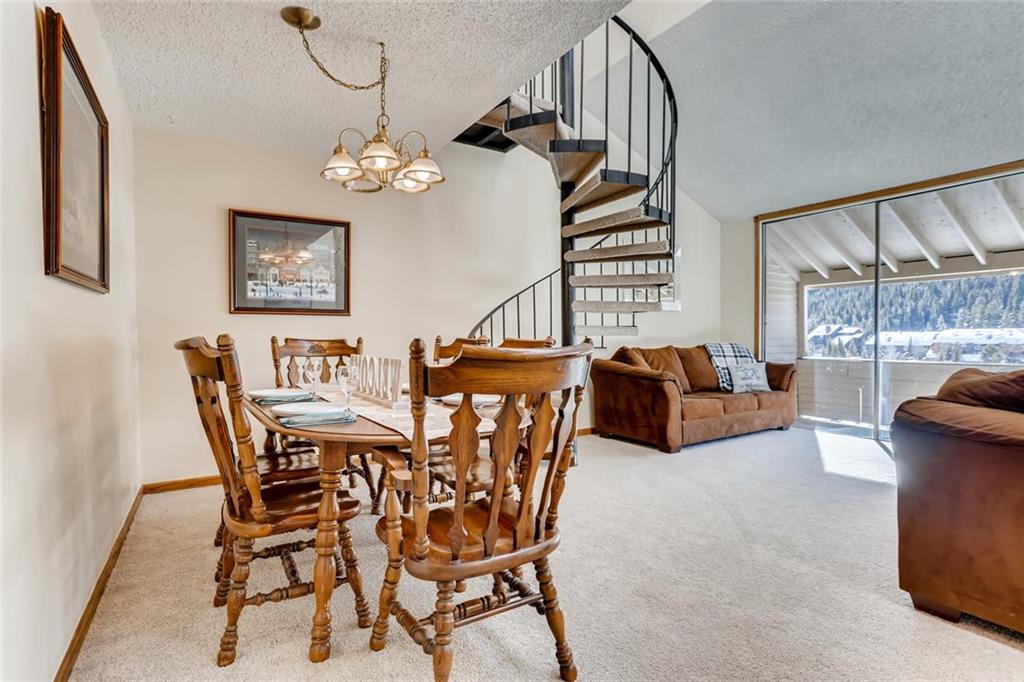 760 Copper Road, Unit 201 Copper Mountain, CO 80443 - Photo 6 of 28 a view of a livingroom with furniture and a chandelier