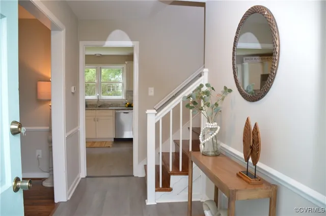 a view of an entryway with wooden floor