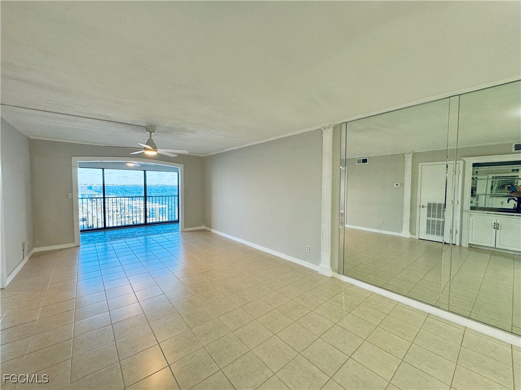 2711 First Street, Unit 102 Fort Myers, FL 33916 - Photo 2 of 36 wooden floor in an empty room with a window