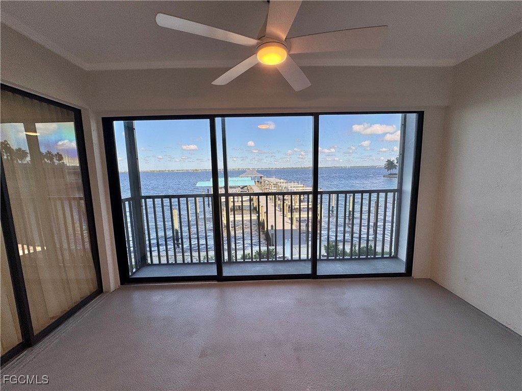 2711 First Street, Unit 102 Fort Myers, FL 33916 - Photo 25 of 36 wooden floor in an empty room with a window
