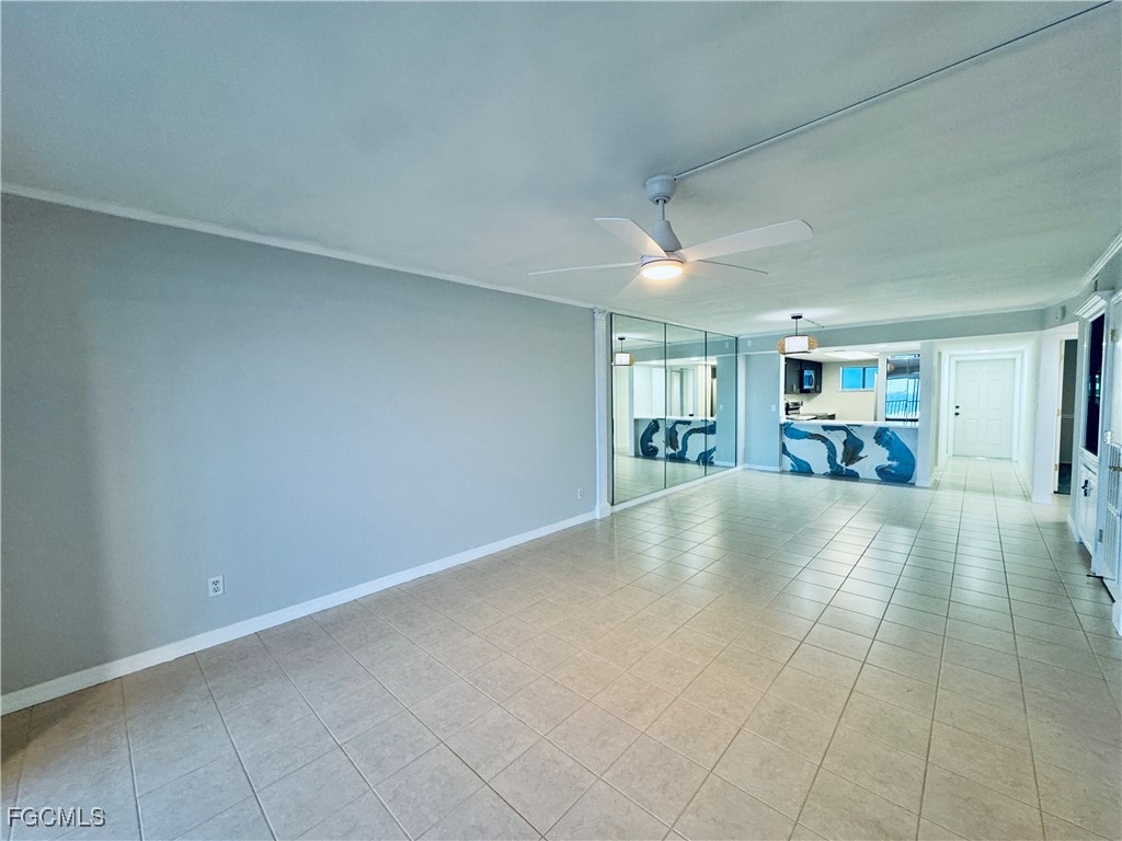 2711 First Street, Unit 102 Fort Myers, FL 33916 - Photo 3 of 36 an empty room with furniture and a window