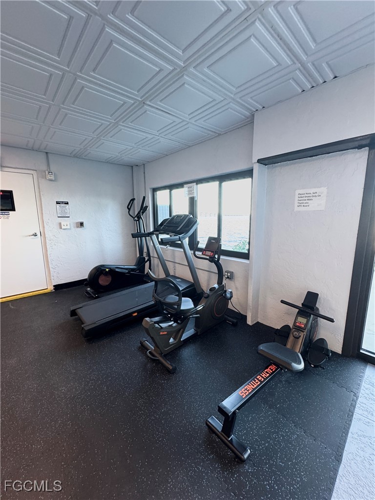 2711 First Street, Unit 102 Fort Myers, FL 33916 - Photo 35 of 36 a room with gym equipment on the wall