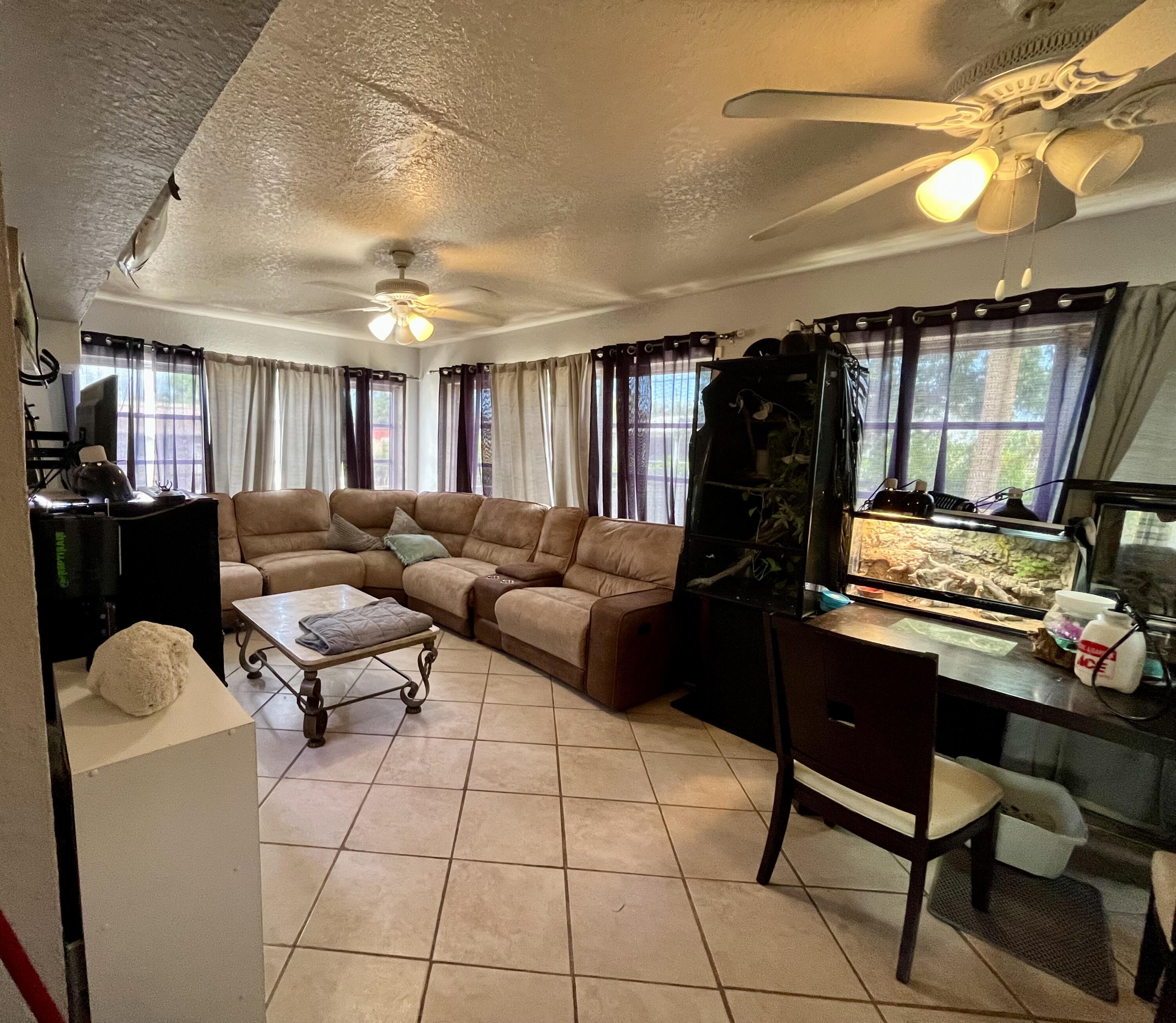 1424 Crest Drive Lake Worth, FL 33461 - Photo 13 of 16 a living room with furniture and a flat screen tv
