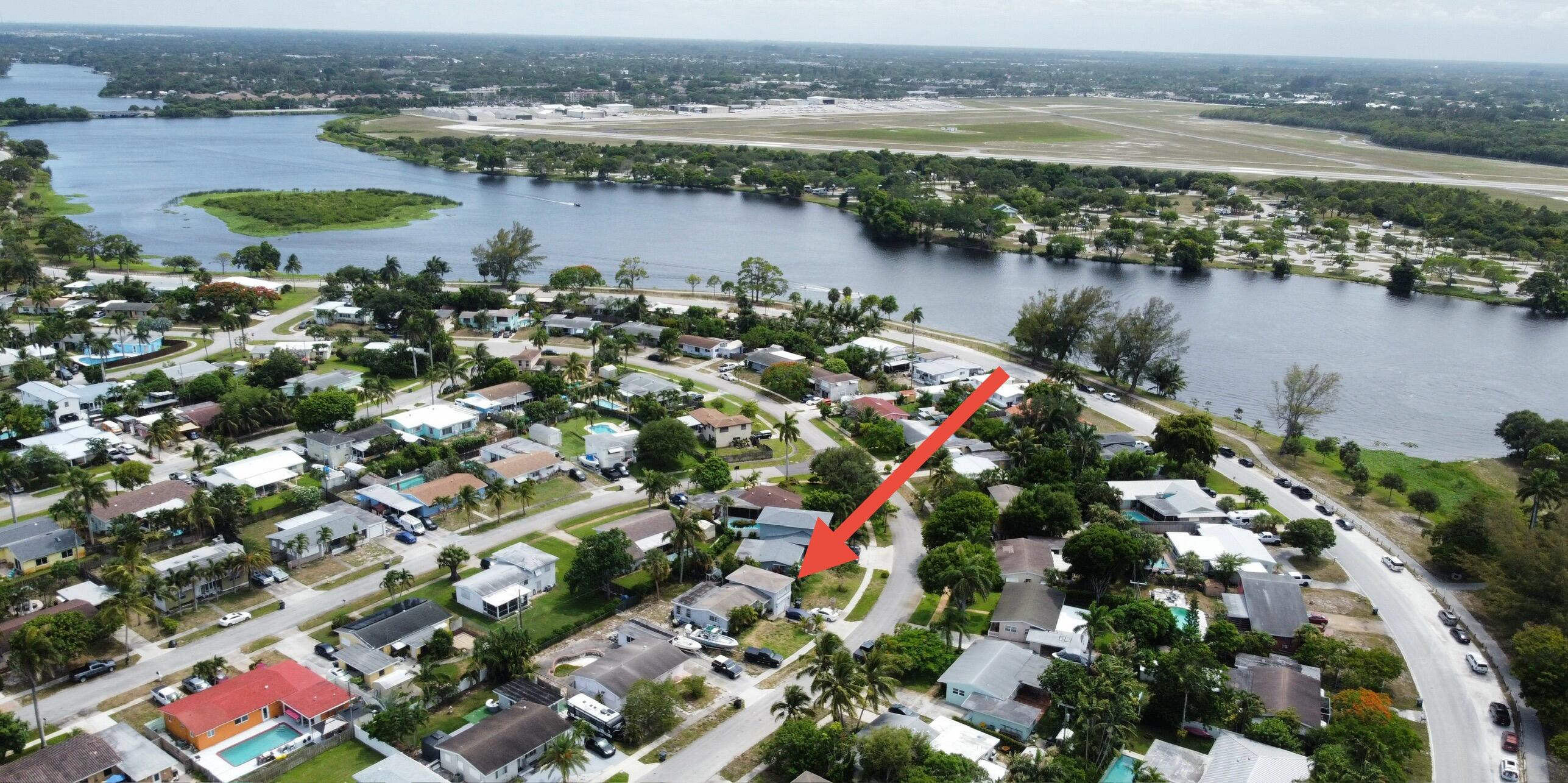 1424 Crest Drive Lake Worth, FL 33461 - Photo 15 of 16 an aerial view of lake and residential houses with outdoor space