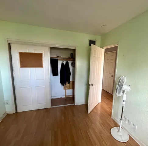 a view of a livingroom with furniture and wooden floor