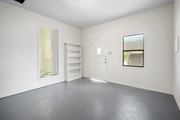 a view of an empty room with a window