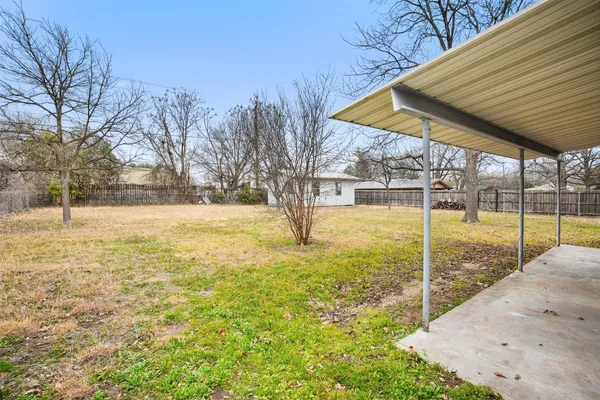 a view of yard with swimming pool